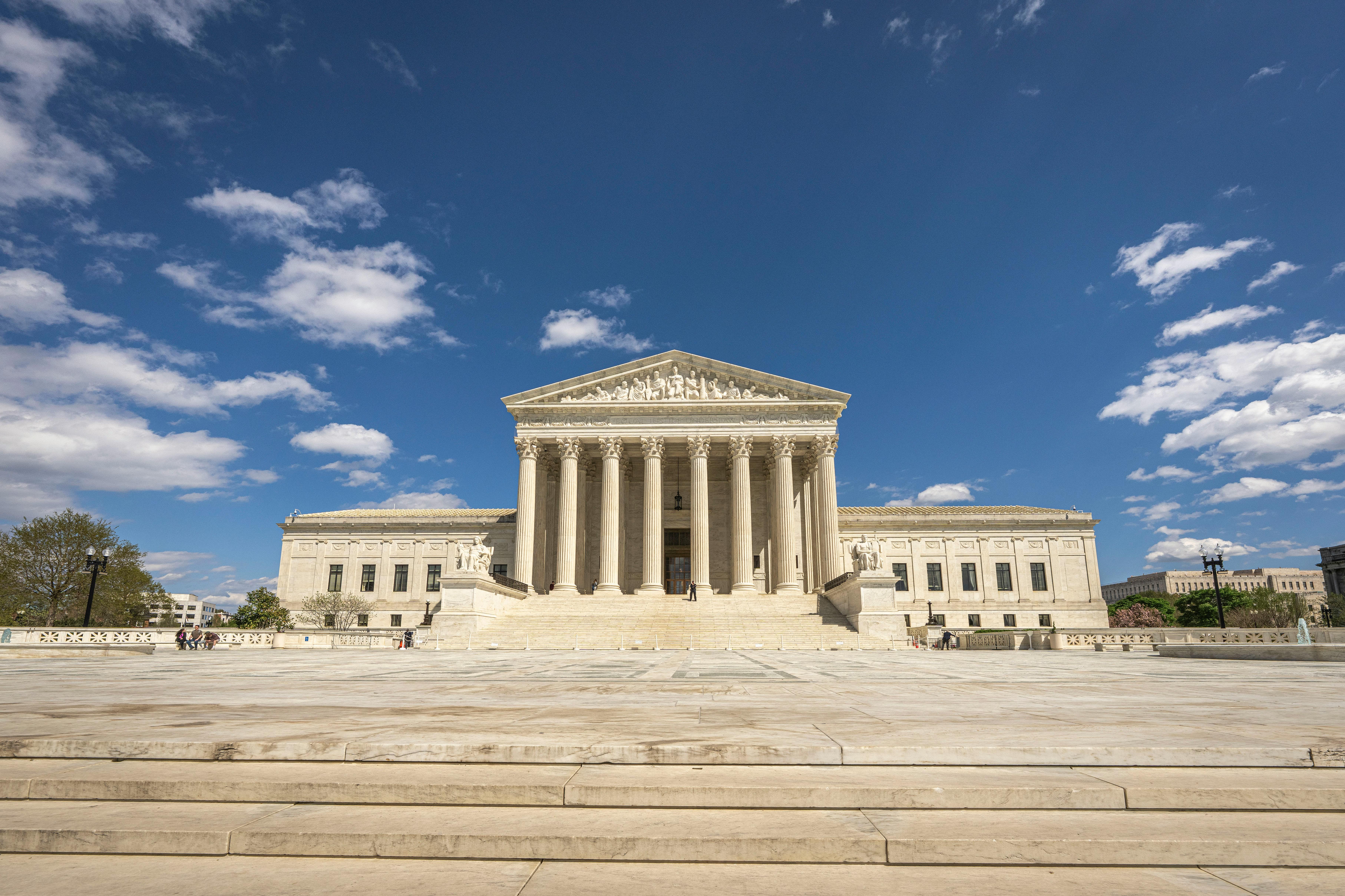 Front view of the United States Supreme Court building on a sunny day