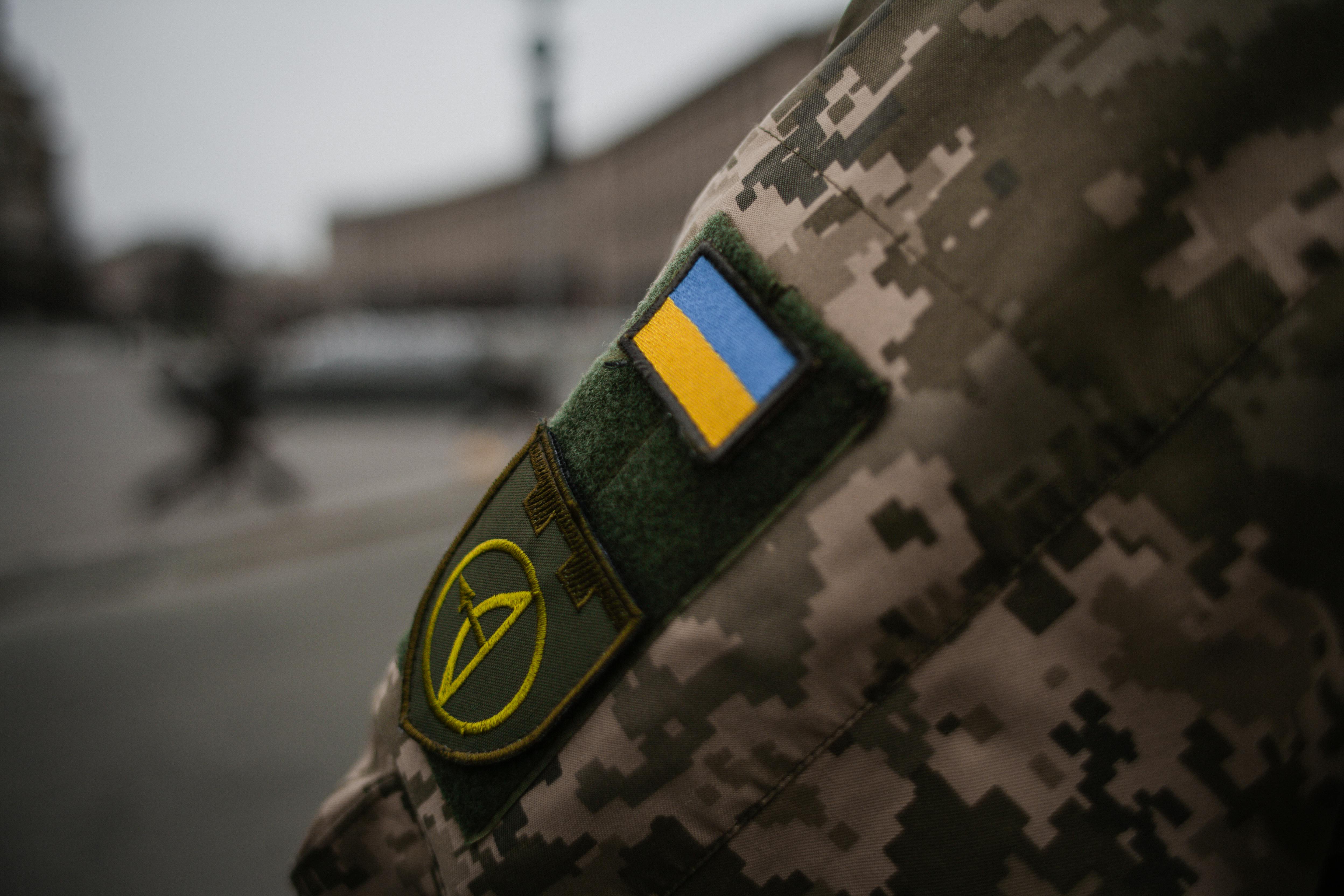 Ukrainian military uniform with flag patch, symbolising the ongoing war and ceasefire negotiations