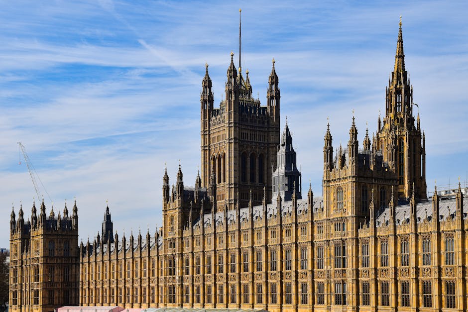 Stunning view of the historic Palace of Westminster in London under a clear blue sky