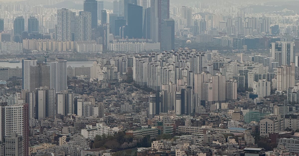 Aerial view of Seoul skyline with towering skyscrapers under a cloudy sky