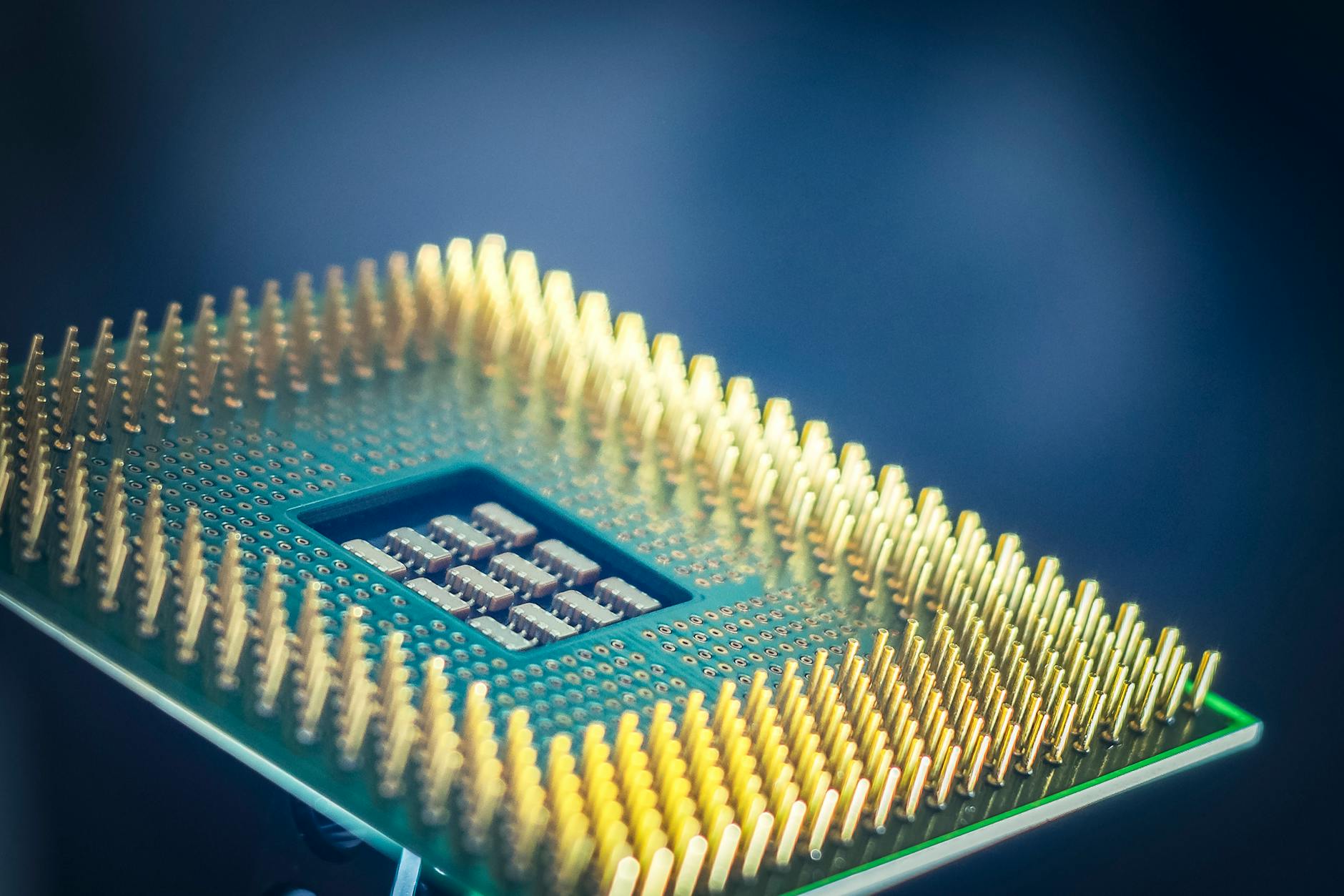Macro view of a high-density processor package, illustrating the custom-silicon class of accelerator at the centre of the OpenAI-Broadcom dispute.