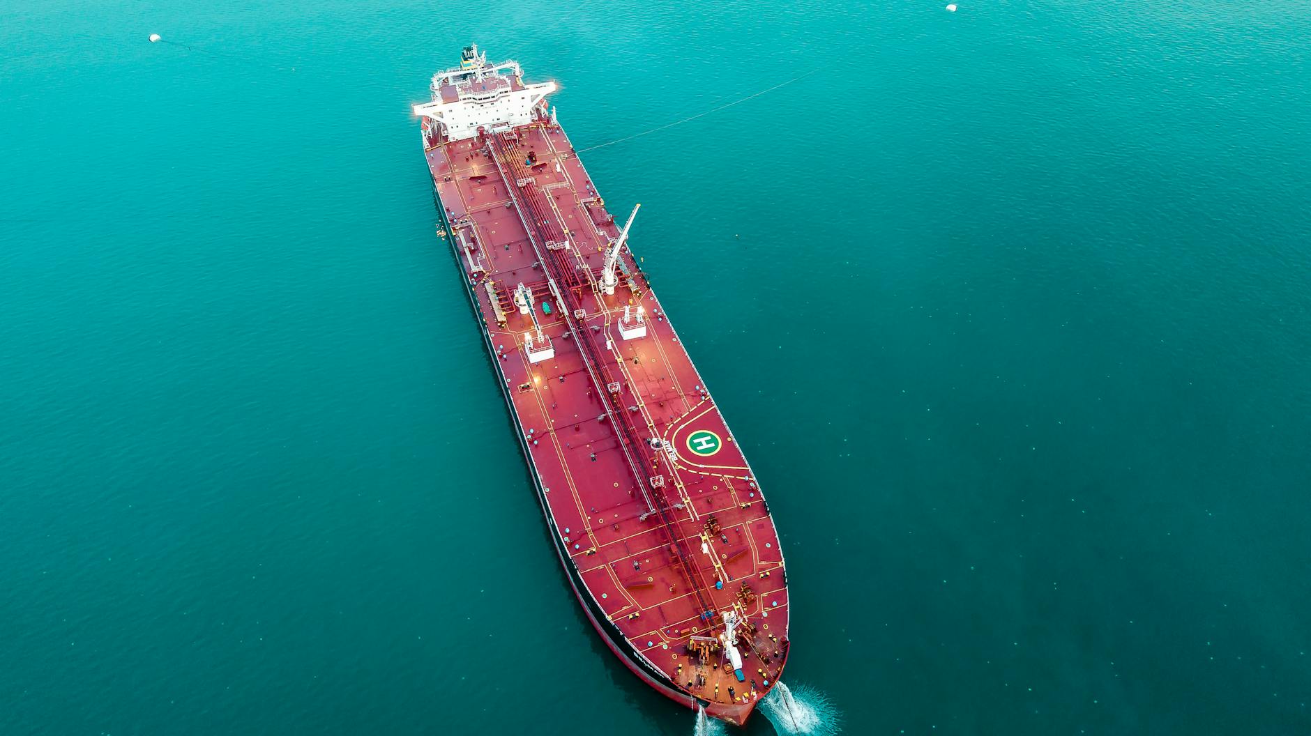 Aerial view of an oil tanker cruising through open ocean.